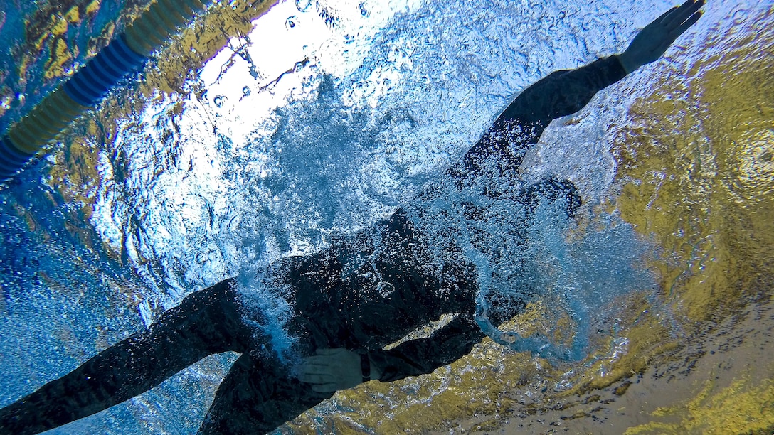 An airman swims a 100-meter challenge during a test for the German Armed Forces Badge for Military Proficiency at Joint Base McGuire-Dix-Lakehurst, N.J., June 13, 2017. The airman is assigned to the New Jersey Air National Guard's 108th Security Forces Squadron. Air National Guard photo by Master Sgt. Matt Hecht