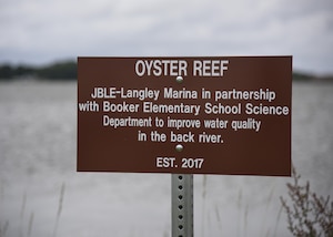 Students from Booker Elementary School plant oysters at Joint Base Langley-Eustis, Va., June 8, 2017. The goal with planting the oysters was for them to multiply into a healthy new oyster rock and ecosystem which in turn creates a healthier bay. (U.S. Air Force photo/Airman 1st Class Anthony Nin Leclerec)
