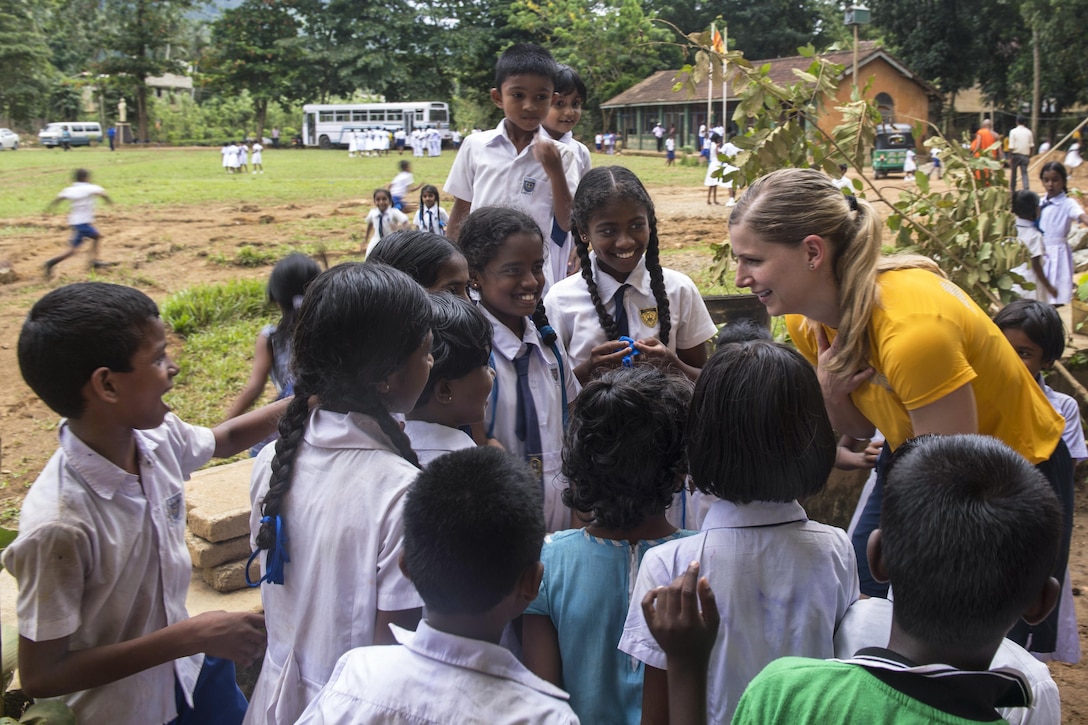 Navy Lt. Christina Appleton greets children at the Mallika Nawodya School in Galle, Sri Lanki, June 14, 2017. Appleton is assigned to the USS Lake Erie, which arrived at the school to support humanitarian assistance operations following severe flooding and landslides in the country. Navy photo by Petty Officer 3rd Class Lucas T. Hans