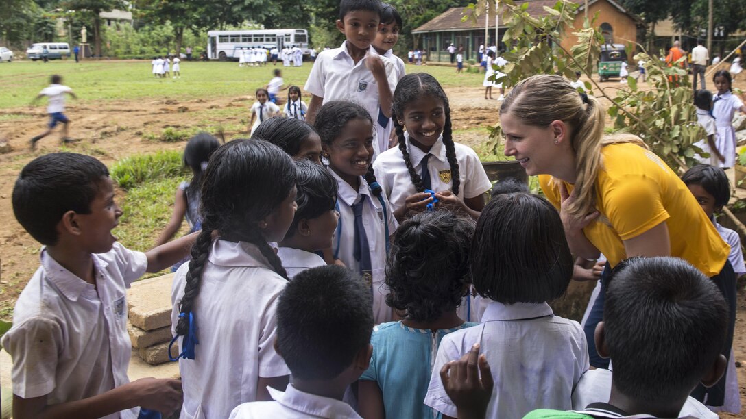 Navy Lt. Christina Appleton greets children at the Mallika Nawodya School in Galle, Sri Lanki, June 14, 2017. Appleton is assigned to the USS Lake Erie, which arrived at the school to support humanitarian assistance operations following severe flooding and landslides in the country. Navy photo by Petty Officer 3rd Class Lucas T. Hans