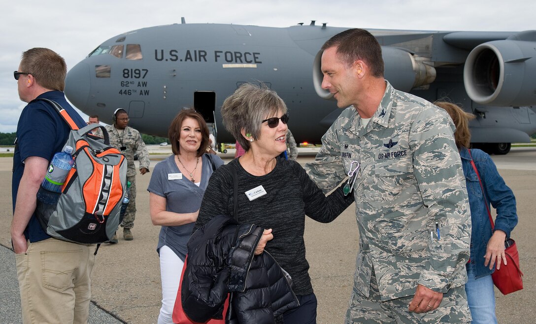 Col. Ethan Griffin, 436th Airlift Wing commander, greets Carlene Joseph with Harborstone Credit Union in Washington, after arriving on a C-17 Globemaster III June 7, 2017 on Dover Air Force Base, Del. Joseph, an Air Mobility Command civic leader to Gen. Carlton Everhart, AMC commander, Scott AFB, Ill., and 18 honorary commanders and civic leaders from Joint Base Lewis-McChord, Wash., came to Dover for a three-day Community Relations Tour. (U.S. Air Force photo by Roland Balik)