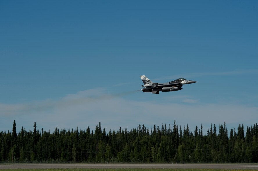 A U.S. Air Force F-16 Aggressor takes off from the flight line during RED FLAG-Alaska 17-2 June 13, 2017, at Eielson Air Base, Alaska. RED FLAG-Alaska provides an optimal training environment in the Indo-Asia Pacific Region and focuses on improving ground, space, and cyberspace combat readiness and interoperabillity for U.S. and international forces.  (U.S. Air Force photo by Airman 1st Class Haley D. Phillips)