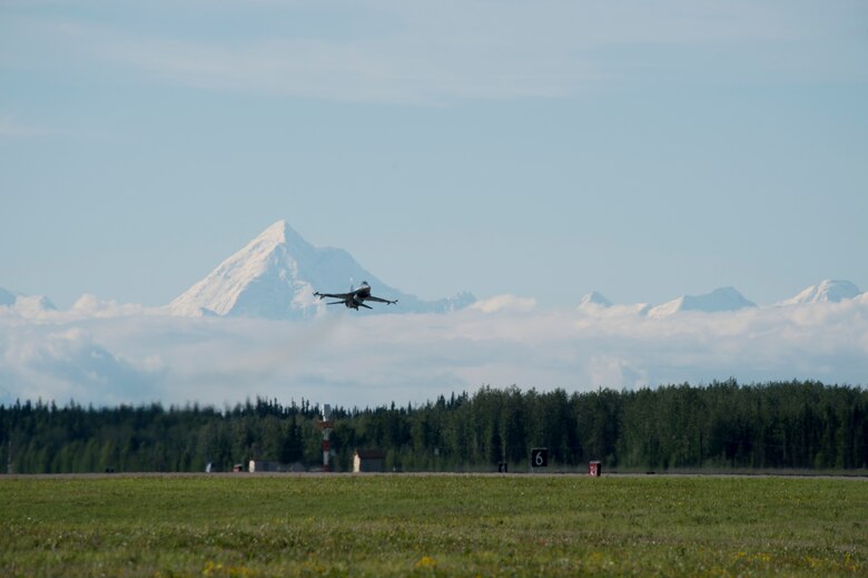 A U.S. Air Force F-16 Aggressor takes off from the flight line during RED FLAG-Alaska 17-2 June 13, 2017, at Eielson Air Base, Alaska. RED FLAG-Alaska provides an optimal training environment in the Indo-Asia Pacific Region and focuses on improving ground, space, and cyberspace combat readiness and interoperabillity for U.S. and international forces.  (U.S. Air Force photo by Airman 1st Class Haley D. Phillips)