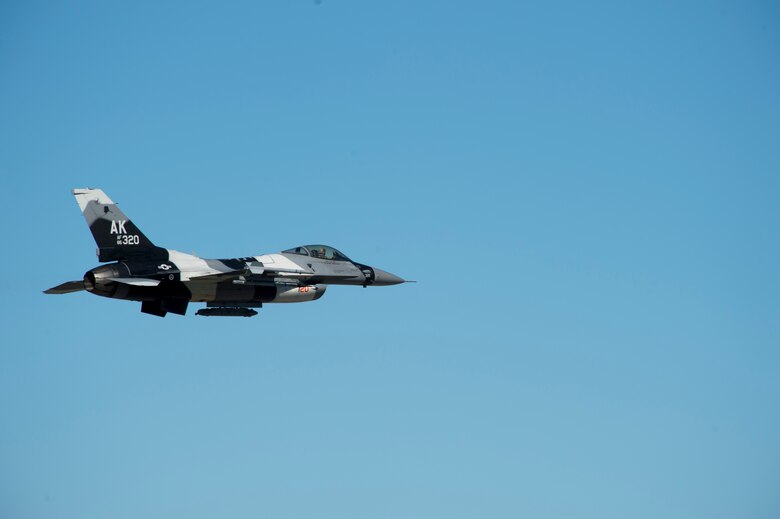 A U.S. Air Force F-16 Aggressor takes off from the flight line during RED FLAG-Alaska 17-2 June 13, 2017, at Eielson Air Base, Alaska. RED FLAG-Alaska provides an optimal training environment in the Indo-Asia Pacific Region and focuses on improving ground, space, and cyberspace combat readiness and interoperabillity for U.S. and international forces.  (U.S. Air Force photo by Airman 1st Class Haley D. Phillips)