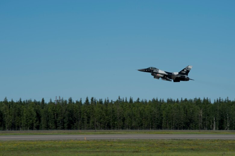 A U.S. Air Force F-16 Aggressor takes off from the flight line during RED FLAG-Alaska 17-2 June 13, 2017, at Eielson Air Base, Alaska. RED FLAG-Alaska provides an optimal training environment in the Indo-Asia Pacific Region and focuses on improving ground, space, and cyberspace combat readiness and interoperabillity for U.S. and international forces.  (U.S. Air Force photo by Airman 1st Class Haley D. Phillips)