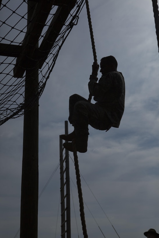 An Army Reserve soldier climbs up a rope obstacle as part of the 2017 U.S. Army Reserve Best Warrior Competition, Fort Bragg, N.C., June 13, 2017. Competitors must try to complete as many obstacles as they can, as fast as they can. The obstacle course is only one event in the entire competition. This year’s Best Warrior Competition will determine the top noncommissioned officer and junior enlisted Soldier who will represent the U.S. Army Reserve in the Department of the Army Best Warrior Competition later this year at Fort A.P. Hill, Va. (U.S. Army Reserve photo by Spc. Milcah Villaronga) (Released)