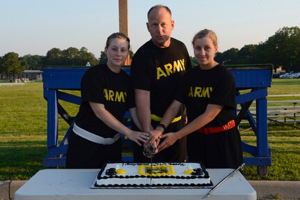 U.S. Army Col. Ralph L. Clayton, 733rd Mission Support Group commander, honors the Army’s 242nd Birthday with a cake cutting ceremony at Joint Base Langley-Eustis, Va., June 14, 2017. Following Army tradition, the youngest Army officer and enlisted member cut the birthday cake alongside the commander. The youngest officer was, left, U.S. Army 2nd Lt. Marie Music, 7th Transportation Brigade (Expeditionary) transportation officer and the youngest enlisted member was, right, U.S. Army Pvt. Kayla Kramer, 128th Aviation Brigade Advanced Individual Training student. (U.S. Air Force photo/Airman 1st Class Kaylee Dubois)