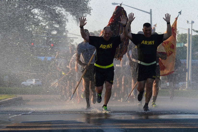 U.S. Army Col. Ralph L. Clayton, 733rd Mission Support Group commander, left, and U.S. Army Command Sgt. Maj. James Herrington, 733rd Mission Support Group command sergeant major, run through water during the Army’s 242nd Birthday Celebration at Joint Base Langley-Eustis, Va., June 14, 2017. After the Revolutionary War, the Continental Army transitioned into the U.S. Army in 1784, consisting of eight infantries and two artillery companies. (U.S. Air Force photo/Airman 1st Class Kaylee Dubois)