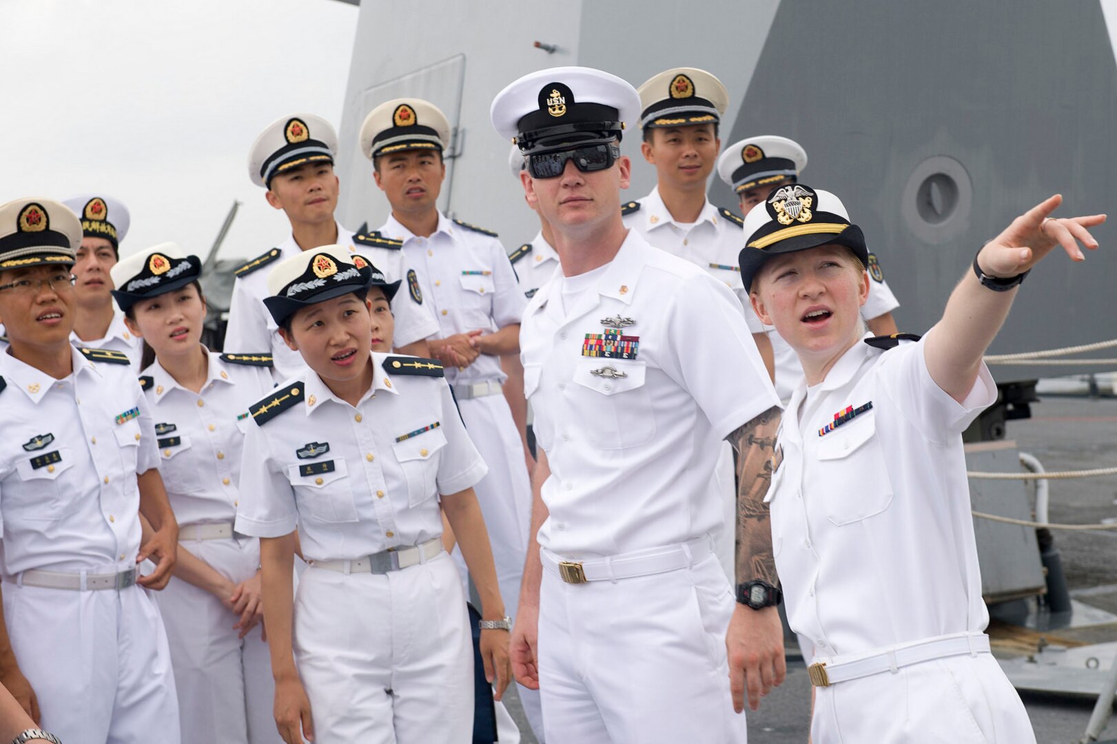 Ensign Deborah Mullen, assigned to Arleigh Burke-class guided-missile destroyer USS Sterett (DDG 104), speaks to a People's Liberation Army (Navy) (PLAN) tour group during a scheduled port visit to Zhanjiang, China, June 14, 2017. Sterett is part of the Sterett-Dewey Surface Action Group and is the third deploying group operating under the command and control construct called 3rd Fleet Forward.