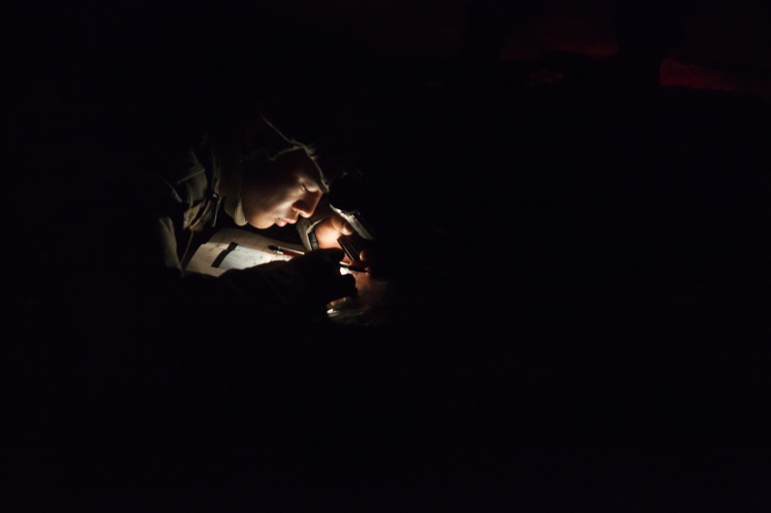 A U.S. Army Reserve soldier plots his grid coordinates during the 2017 U.S. Army Reserve Best Warrior Competition night land navigation course, Fort Bragg, N.C., early morning of June 14, 2017. The night land navigation course is only one event in the entire competition. This year’s Best Warrior Competition will determine the top noncommissioned officer and junior enlisted Soldier who will represent the U.S. Army Reserve in the Department of the Army Best Warrior Competition later this year at Fort A.P. Hill, Va. (U.S. Army Reserve photo by Spc. Milcah Villaronga) (Released)