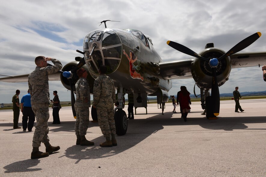 Airmen and their families view a B-25 Mitchell bomber on display during the 34th and 37th Bomb Squadron’s 100th anniversary celebration at Ellsworth Air Force Base, S.D., June 12, 2017. The squadrons are two of the oldest in the Air Force, with the 34th BS formed on May 10, 1917, and the 37th on June 13, 1917. (U.S. Air Force photo by Airman 1st Class Donald C. Knechtel)