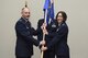 U.S. Air Force Col. Janet Urbanski, the new 17th Medical Group Commander, receives the guideon from Col. Michael Downs, 17th Training Wing Commander, during the 17th MDG Change of Command ceremony at the Event Center on Goodfellow Air Force Base, Texas, June 13, 2017. Urbanski previously served as commander of the 81st Medical Support Squadron out of Keesler Air Force Base. (U.S. Air Force photo by Airman 1st Class Chase Sousa/Released)