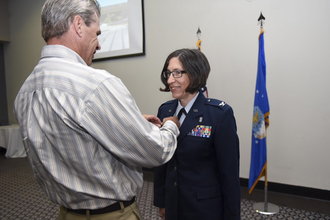 U.S. Air Force Col. Janet Urbanski, the new 17th Medical Group Commander, receives a command pin at the Event Center on Goodfellow Air Force Base, Texas, June 13, 2017. The pinning ceremony symbolizes filling the role of commander. (U.S. Air Force photo by Airman 1st Class Chase Sousa/Released)