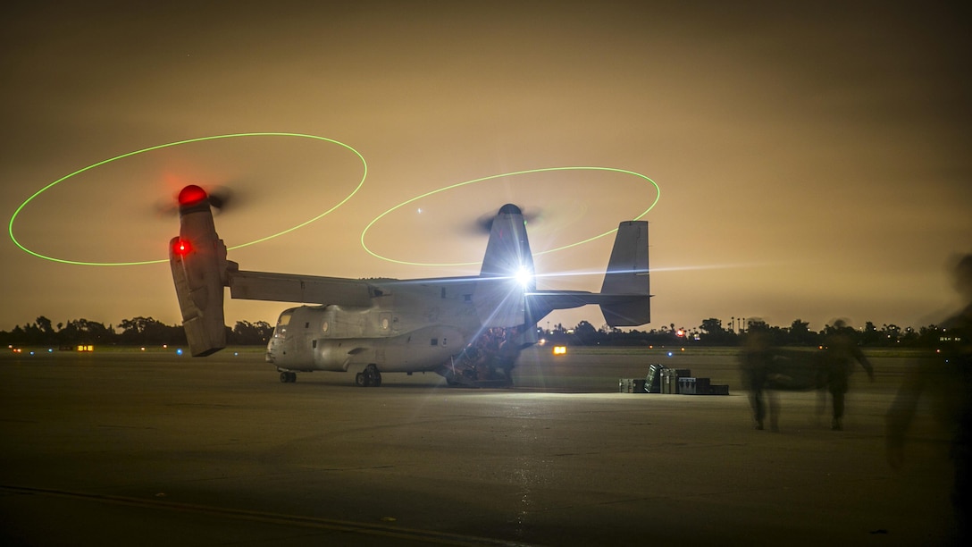 Marines load gear into an MV-22B Osprey after completing a noncombatant evacuation and mass casualty drill at Joint Forces Training Base Los Alamitos, Calif., June 6, 2017. The Marines are assigned to the 15th Marine Expeditionary Unit. Marine Corps photo by Cpl. Frank Cordoba