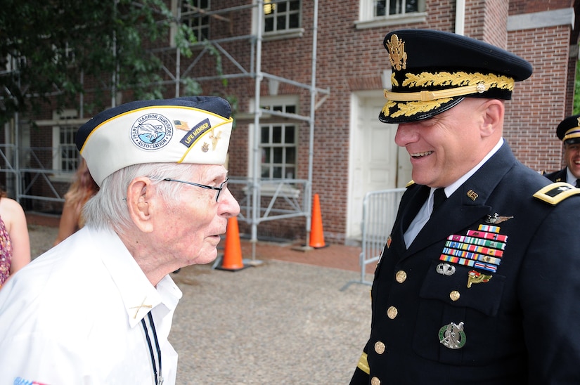 Maj. Gen. Troy D. Kok, commanding general of the U.S. Army Reserve’s 99th Regional Support Command (right), speaks with Pvt. Alex Horanczy, a Pearl Harbor Survivor who served with the 42nd Infantry Division, prior to the start of the Stripes and Stars Festival celebrating the U.S. Army 242nd birthday June 14 at Independence Hall in Philadelphia.