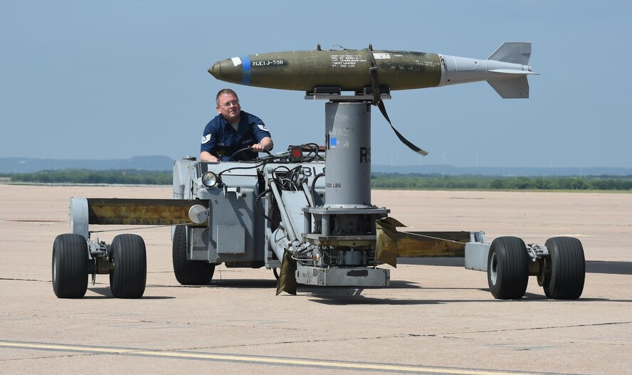 U.S. Air Force Tech. Sgt. Clayton Moore, 489th Maintenance Squadron weapons load crew member, transports a global positioning system-guided inert bomb unit using a jammer during the 2017 Global Strike Challenge at Dyess Air Force Base, Texas, June 13, 2017. The jammer is used to load and unload munitions into the B-1B Lancer. The GSC is a competition that showcases the world’s best bombers, maintenance and security forces personnel units performing the Air Force Global Strike Command mission. (U.S. Air Force photo by Airman 1st Class Emily Copeland)