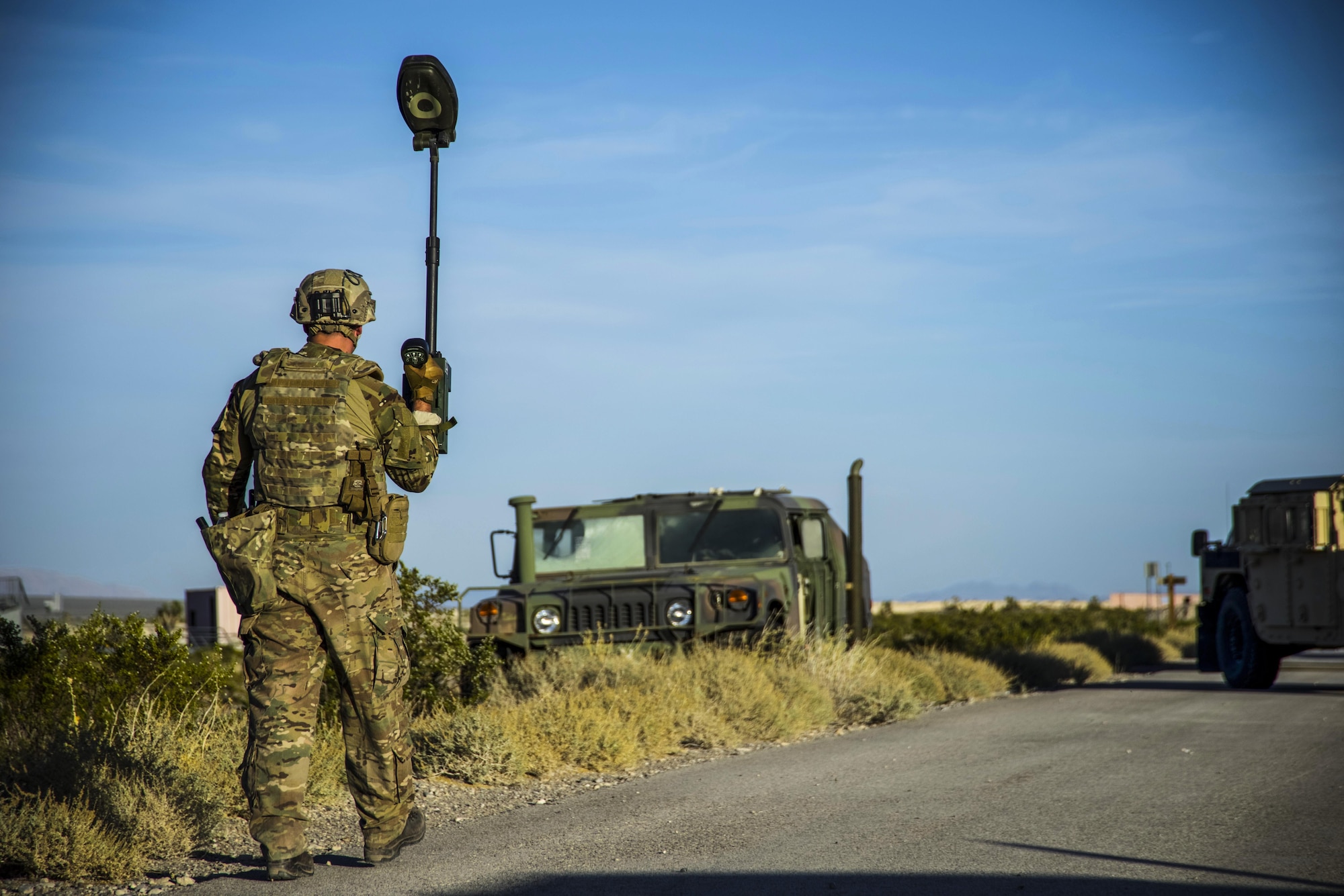 Staff Sgt. Myles Corbin, 99th Civil Engineer Squadron explosive ordnance disposal technician, completes a roadside bomb clearance operation at the Nevada Test and Training Range, June 7, 2017. Roadside bomb clearance operations ensure supply lines stay active in a deployed environment. (U.S. Air Force photo by Airman 1st Class Andrew D. Sarver/Released)