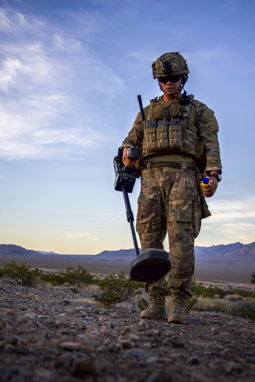 Staff Sgt. Jeremiah Alejandro, 99th Civil Engineer Squadron explosive ordnance disposal team member, performs an improvised explosive device clearance operation during a training exercise at the Nevada Test and Training Range June 7, 2017. The EOD teams alternated team members to perform the clearance operations to ensure each scenario was different. (U.S. Air Force photo by Airman 1st Class Andrew D. Sarver/Released)