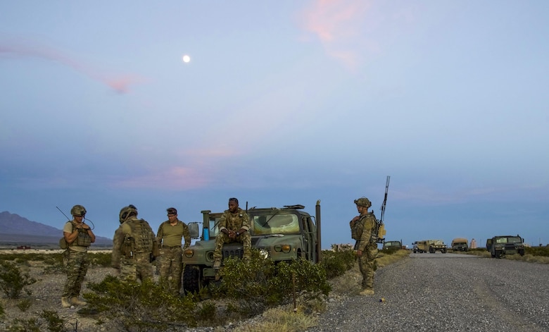 99th Civil Engineer Squadron explosive ordnance disposal team members observe an improvised explosive device clearance operation during a training exercise at the Nevada Test and Training Range, June 7, 2017. The teams evaluated each other on their ability to defeat a roadside bomb without triggering a premature detonation. (U.S. Air Force photo by Airman 1st Class Andrew D. Sarver/Released)