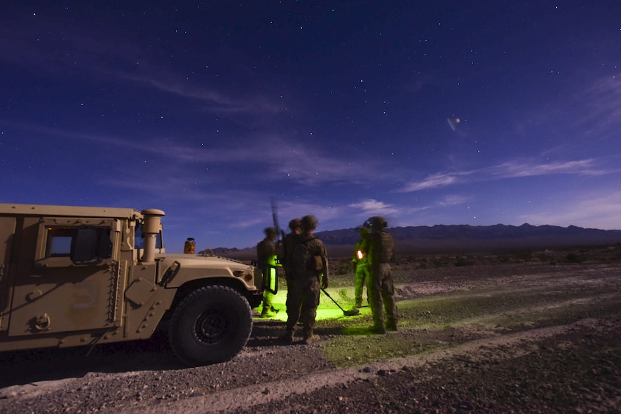 99th Civil Engineer Squadron explosive ordnance disposal team members prepare for a night operation during a training exercise at the Nevada Test and Training Range June 7, 2017. The operation tasked the team members with identifying and safely disposing of a simulated roadside bomb. (U.S. Air Force photo by Airman 1st Class Andrew D. Sarver/Released)