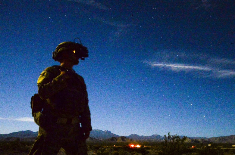 Staff Sgt. Jeremiah Alejandro, 99th Civil Engineer Squadron explosive ordnance disposal team member, uses a pair of night vision goggles during a training exercise at the Nevada Test and Training Range June 7, 2017. Night vision goggles allow the user to operate in low-light conditions. (U.S. Air Force photo by Airman 1st Class Andrew D. Sarver/Released)