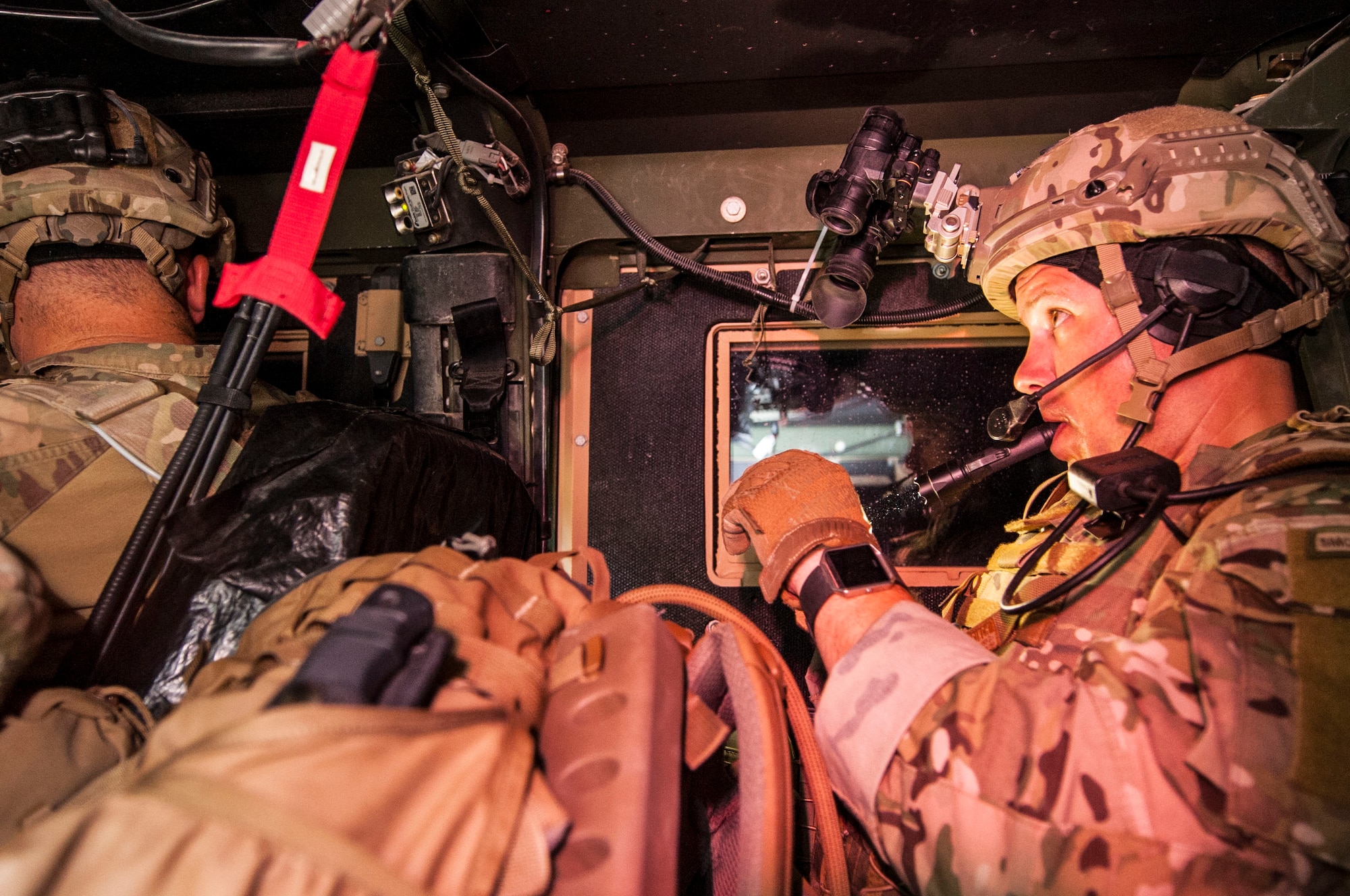 Tech. Sgt. Nathanial Jackson, 99th Civil Engineer Squadron explosive ordnance disposal technician, checks his night vision system during a roadside bomb clearing training event June 7, 2017 at the Nevada Test and Training Range. Low-light situations add another layer of difficulty to a task that already requires the highest level of attention to detail. (U.S. Air Force photo by Senior Airman Joshua Kleinholz/Released)