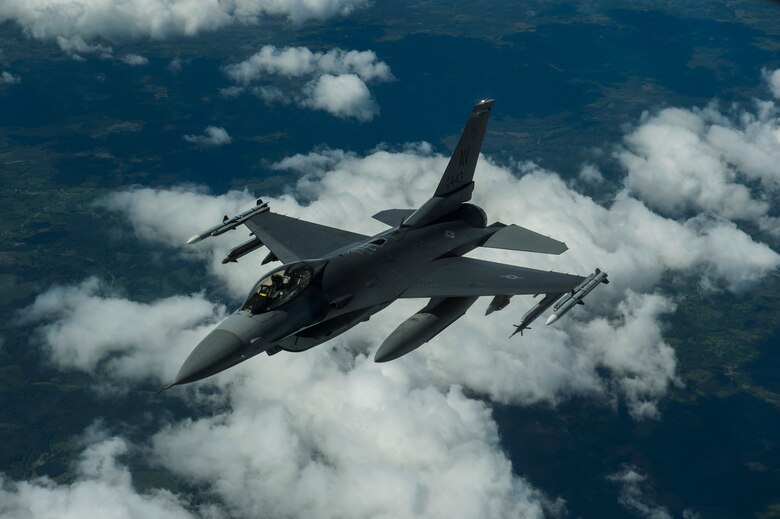 An F-16 Fighting Falcon, 510th Fighter Squadron, deployed to Krzesiny Air Base, Poland, in support of Aviation Detachment rotation 17-3, exercise BALTOPS and exercise Saber Strike, breaks away after refueling from a KC-135R Stratotanker over Latvia, June 14, 2017. The exercise is designed to enhance flexibility and interoperability, to strengthen combined response capabilities, as well as demonstrate resolve among Allied and Partner Nations' forces to ensure stability in, and if necessary defend, the Baltic Sea region. (U.S. Air Force photo by Staff Sgt. Jonathan Snyder)