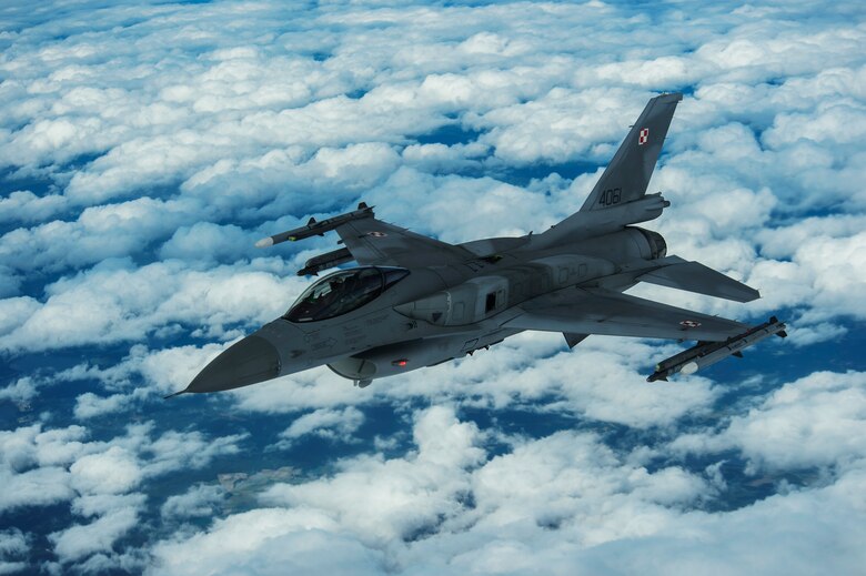 A Polish air force F-16 Fighting Falcon breaks away after refueling from a KC-135R Stratotanker during BALTOPS over Latvia, June 14, 2017. BALTOPS is an annually recurring multinational exercise designed to enhance flexibility and interoperability, as well as demonstrate resolve of allied and partner forces to defend the Baltic region. Participating nations include Belgium, Denmark, Estonia, Finland, France, Germany, Latvia, Lithuania, the Netherlands, Norway, Poland, Sweden, the United Kingdom, and the United States. (U.S. Air Force photo by Staff Sgt. Jonathan Snyder)