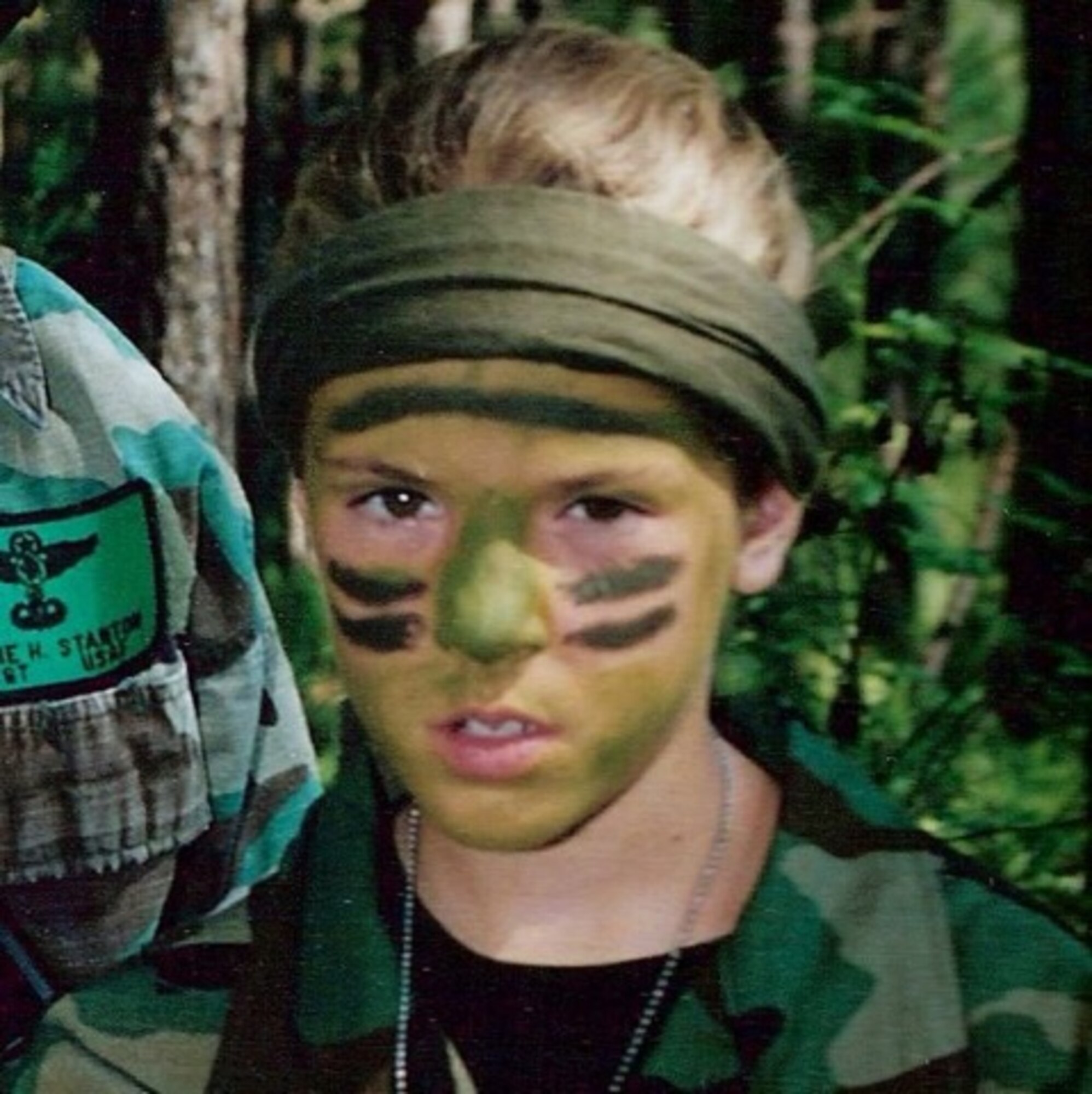 A young Bethany Bowater displays her early camouflage skills during a trip with her father. Bowater would go on to fulfill her father's dream of joining the Survival Evasion Resistance Escape school to as a SERE Specialist. (courtesy photo)