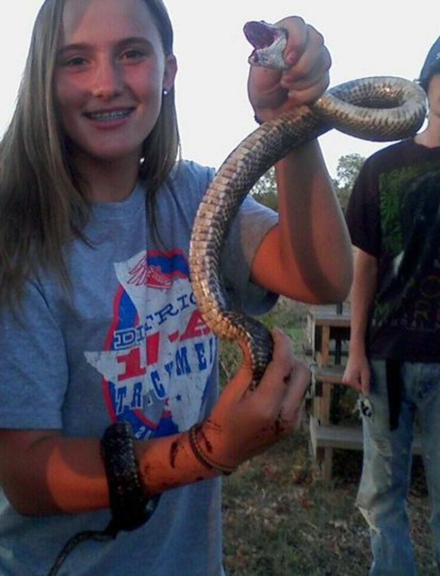 A young Brittany Wilson holds a snake she caught in her home state of Texas. Wilson would go on to join the U.S. Air Force as a Survival Specialist. (courtesy photo)