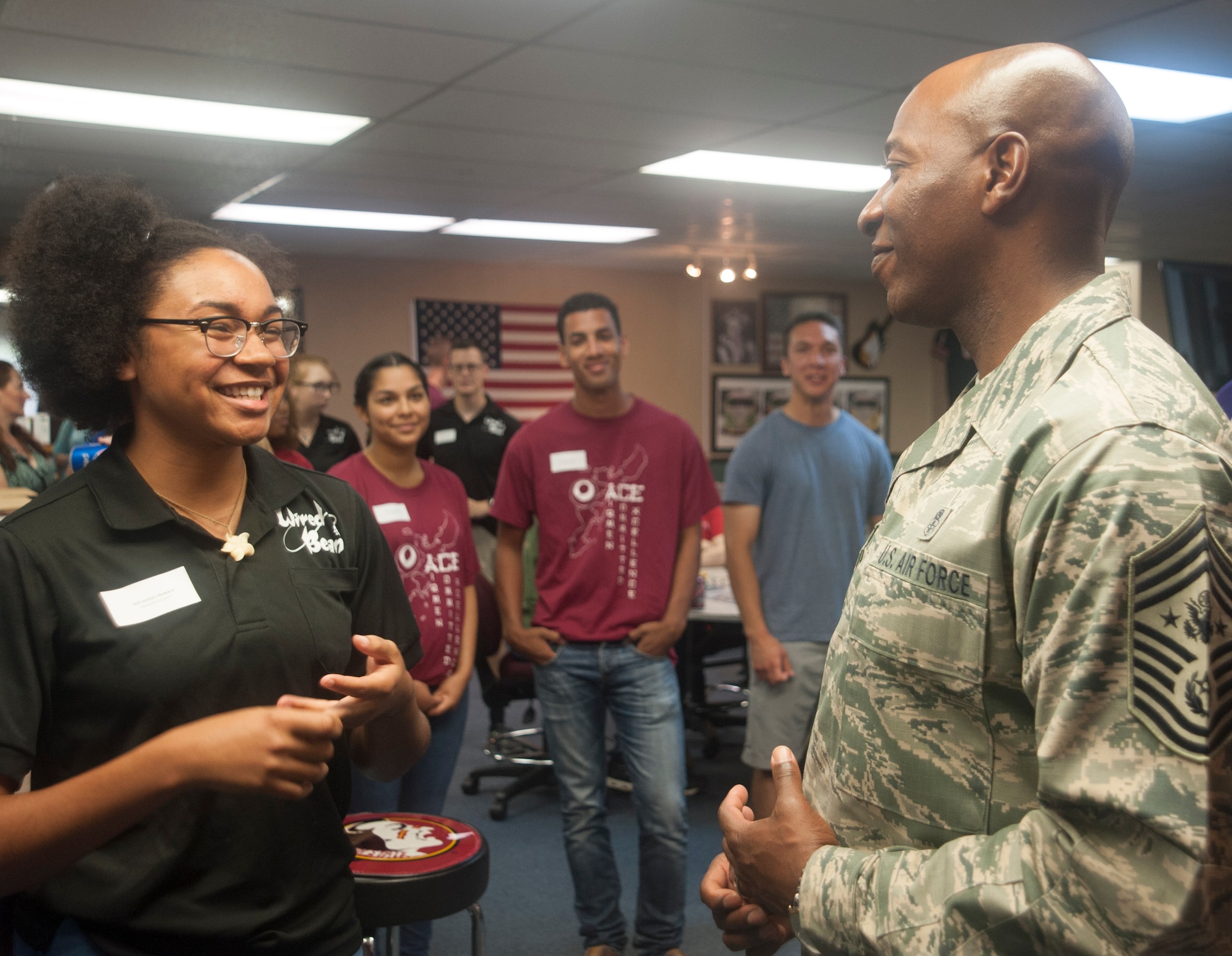 Chief Master Sgt. of the Air Force Kaleth O. Wright speaks with Senior Airman Jordan Howard, a member of the Wired Bean council, June 12, 2017, at Kadena Air Base, Japan. The Wired Bean offers Airmen an alcohol-free, tobacco-free, and profanity-free environment to have fun, meet friends, and give back to the community. Wright visited Pacific Air Forces bases to discuss his priorities, mission readiness through resilience and accomplishments of PACAF Airmen. (U.S. Air Force photo by Senior Airman Quay Drawdy)