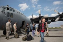 Family members representing installations and commands throughout the Korean Peninsula exist a U.S. Air Force C-130 Hercules at Yokota Air Base, Japan, June 6, 2017 for noncombatant evacuation exercise Focused Passage 2017. The exercise takes place at US military installations throughout the Korean Peninsula and is designed to ensure service members are prepared to evacuate designated noncombatants. (U.S. Air Force photo by Yasuo Osakabe)