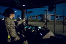 U.S. Air Force Staff Sgt. Genny Wehe, 730th Air Mobility Squadron training manager, drives a bus on the flightline at Yokota Air Base, Japan, June 6, 2017, during exercise Focused Passage 2017. FP 2017 is a Noncombatant Evacuation Operations readiness exercise. The exercise took place at U.S. military installations throughout the Korean Peninsula and is designed to ensure service members are prepared to evacuate designated noncombatants. (U.S. Air Force photo by Yasuo Osakabe)
