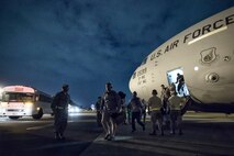 U.S. Army Solders get off a C-17 Globemaster III at Yokota Air Base, Japan, June 6, 2017, during exercise Focused Passage 2017. Eighth Army conducts Noncombatant Evacuation Operations administrative and training tasks designed to inspect NEO packets, conduct NEO representative/warden training, NEO tracking system (NTS) operator training, and account for all Department of Defense noncombatants. (U.S. Air Force photo by Yasuo Osakabe)