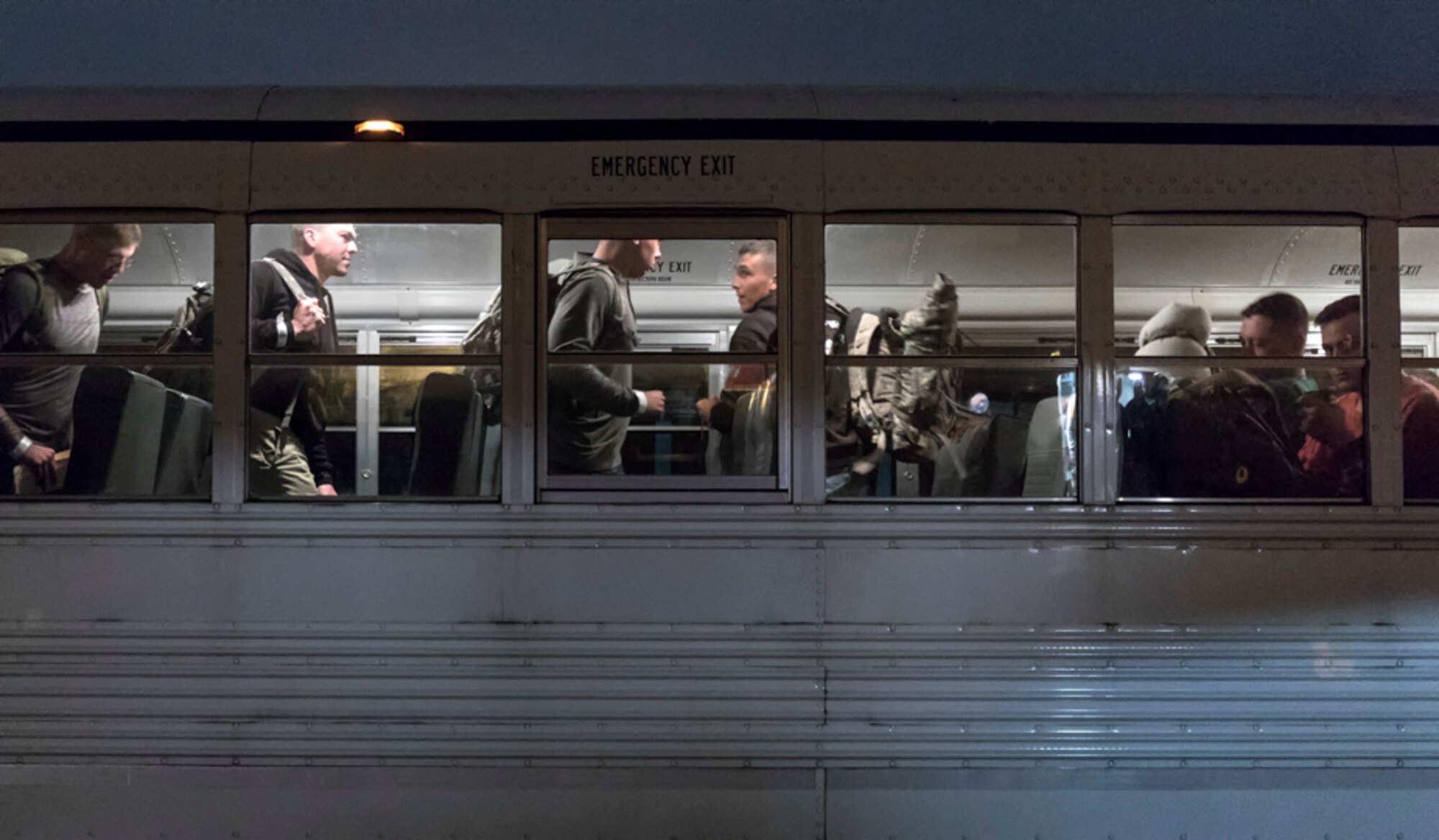 U.S. Army Solders board a bus at Yokota Air Base, Japan, June 6, 2017 for noncombatant evacuation exercise Focused Passage 2017. FP 2017 is designed to ensure Eighth Army service members and families are prepared to evacuate during a crisis situation. During the exercise, noncombatant evacuees are required to have their NEO packets checked by their unit NEO warden. (U.S. Air Force photo by Yasuo Osakabe)