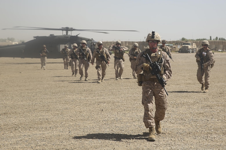 U.S. Marines with Task Force Southwest depart a UH-60 Blackhawk helicopter prior to an advisory meeting with Afghan National Army soldiers at Camp Hanson, Afghanistan, June 13, 2017. Marines and Sailors from Task Force Southwest are currently supporting and assisting the 1st and 3rd Brigades of the 215th Corps during Maiwand Three offensive operations to clear insurgents from the Nad-e Ali and Marjah areas. (U.S. Marine Corps photo by Sgt. Lucas Hopkins)