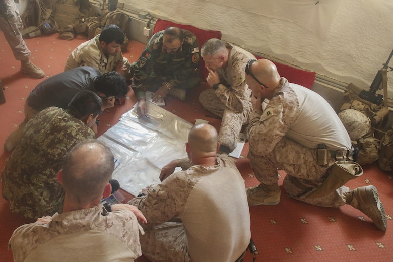 U.S. Marines with Task Force Southwest and Afghan National Army soldiers with the 215th Corps plan for the continuation of offensive combat operations at Camp Hanson, Afghanistan, June 13, 2017. The 215th Corps’ 1st and 3rd Brigades recently began offensive actions in the Nad-e Ali and Marjah areas in support of Maiwand Three operations. (U.S. Marine Corps photo by Sgt. Lucas Hopkins)