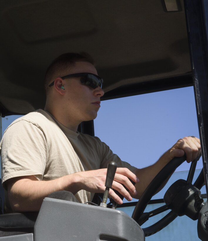 Senior Airman Giovany Tellez, 455th Expeditionary Logistics Readiness Squadron traffic management office, operates a forklift at Bagram Airfield, Afghanistan, June 13, 2017. The 455th ELRS TMO receives vast amounts of cargo each day, and utilizes various vehicles such as forklifts and flatbed trucks to get them where they need to be. (U.S. Air Force photo by Staff Sgt. Benjamin Gonsier)