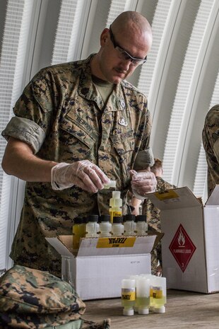 Gunnery Sgt. Vance Bercot prepares a liquid binary explosive called TEXPAK during demolition exercise at the Explosive Ordnance Range aboard Marine Corps Air Station Beaufort, June 1. The MCAS Beaufort EOD Marines conducted the demolition exercise to detonate unused TEXPAK explosives left over from the 2017 MCAS Beaufort Air Show and to practice for future air shows. Bercot is an EOD technician with EOD, MCAS Beaufort.