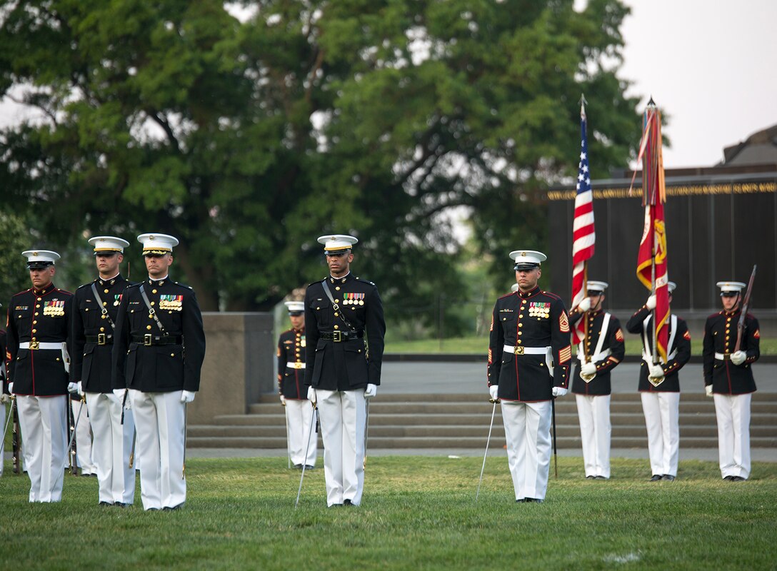 Marines of the parade staff prepare to execute pass in review during a Tuesday Sunset Parade at the Marine Corps War Memorial, Arlington, Va., June 13, 2017. The guest of honor for the parade was the Honorable Marcy Kaptur, U.S. Representative from the 9th Congressional District of Ohio, and the hosting official was Lt. Gen. Gary Thomas, deputy commandant, Programs and Resources. (Official U.S. Marine Corps photo by Cpl. Robert Knapp/Released)