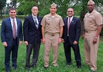 DAHLGREN, Va. - Rear Adm. Patrick Piercey, Naval Surface Force Atlantic commander, center, is pictured with Naval Surface Warfare Center Dahlgren Division (NSWCDD) leadership at the command's Asian American and Pacific Islander Heritage Month Observance. After his keynote speech, Piercey received technical briefings during a tour of NSWCDD facilities and laboratories dedicated to directed energy, surface warfare, and cybersecurity research, development, test and evaluation. Standing left to right: Dale Sisson, NSWCDD deputy technical director; Jim Yee, NSWCDD deputy department head for gun and electric weapon systems; Piercey; Gaurang Dävé, NSWCDD senior cyber technical advisor; and Capt. Gus Weekes, NSWCDD commanding officer. 