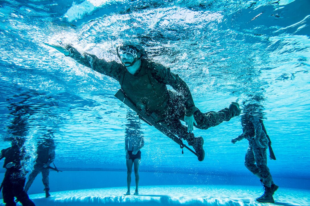 A U.S. Marine with 1st Marine Logistics group participates in the water survival advanced course on Camp Pendleton, California, June 14, 2017. The purpose of the water survival course is to strengthen the individual Marine’s self-preservation and rescue skills in water. 1st MLG is home to multiple military occupations that work together to provide support to each element of the 1st Marine Expeditionary Force through logistics beyond the capabilities of the supported units.