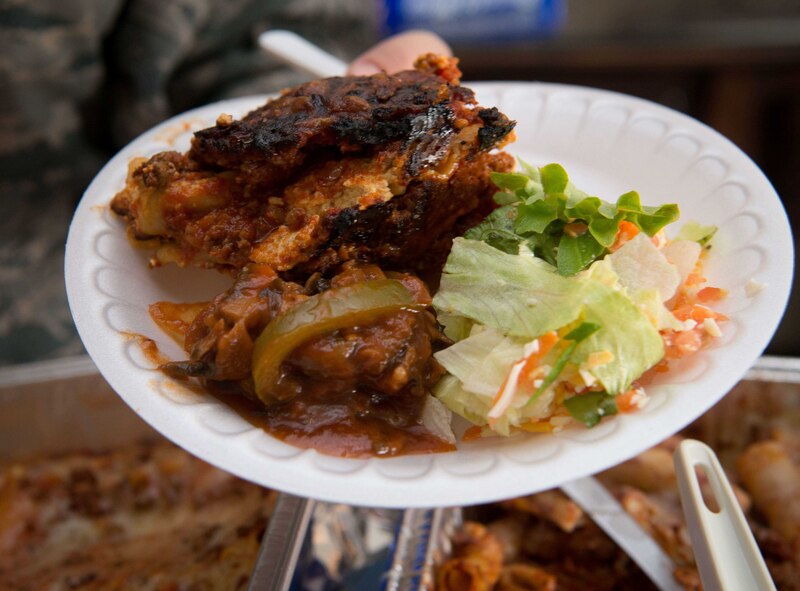 An Airman participates in a Friday night free meal at Club 7 on Ramstein Air Base, June 10, 2017. Run by the 86th Airlift Wing Chapel, the Ramstein Club 7 offers junior enlisted Airmen a number of services, including free meals starting at 6:00 p.m. every Friday, and free resiliency trips that include activities like snowboarding and sky diving. (U.S. Air Force photo by Senior Airman Elizabeth Baker)