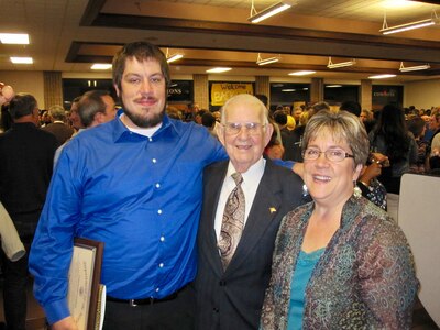Brett Gillard poses with his mother, Peggy Gillard, and grandfather, Ernie Schramm, following graduation from the Puget Sound Naval Shipyard Apprentice Program. Brett and his mother are current employees and Schramm retired from the command in 1981. (Personal photo provided by Peggy Gillard)