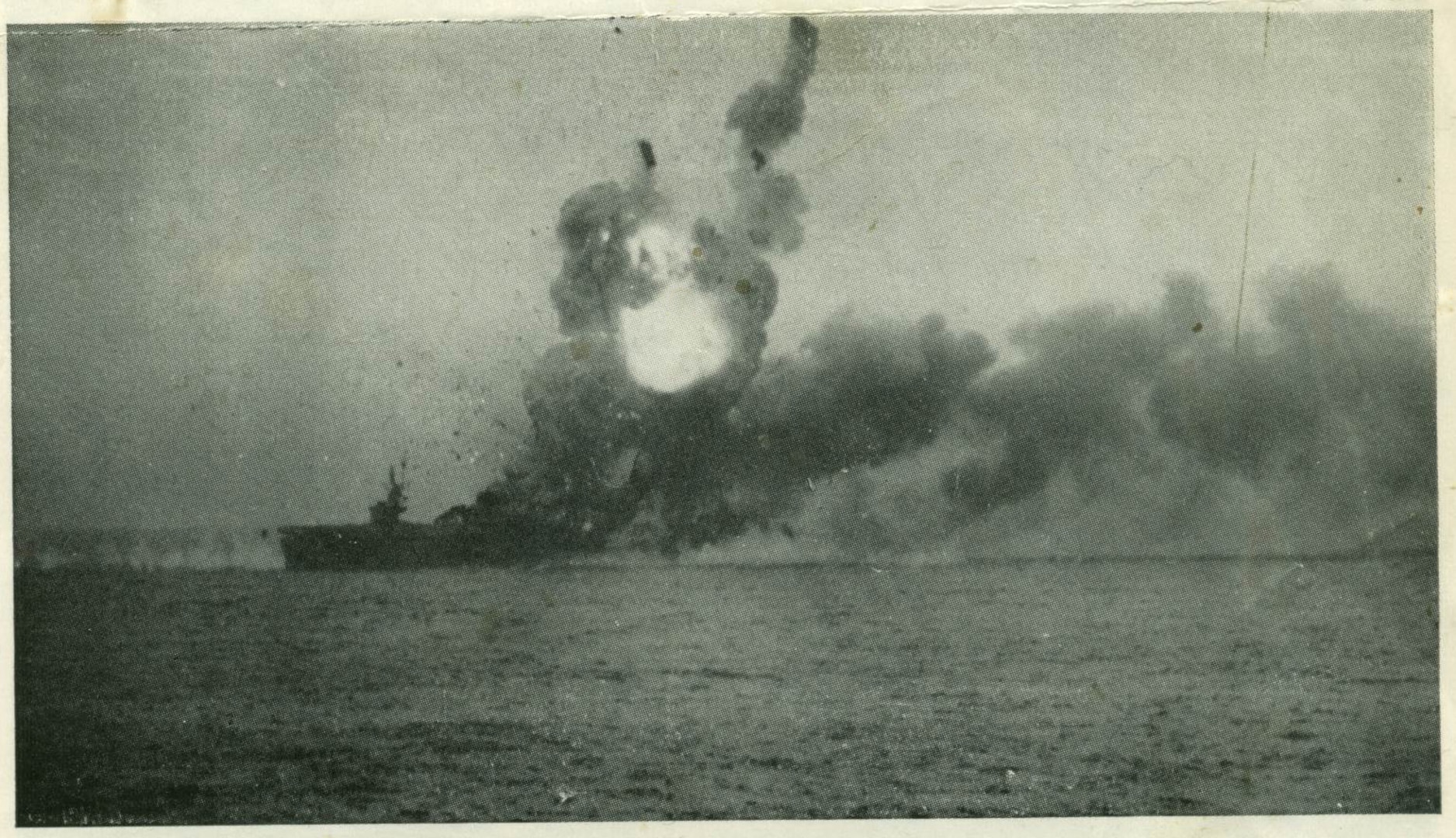 USS St. Lo (CVE 63) is badly damaged after a Japanese kamikaze plane hit the ship and caused an explosion. (U.S. Navy photo)