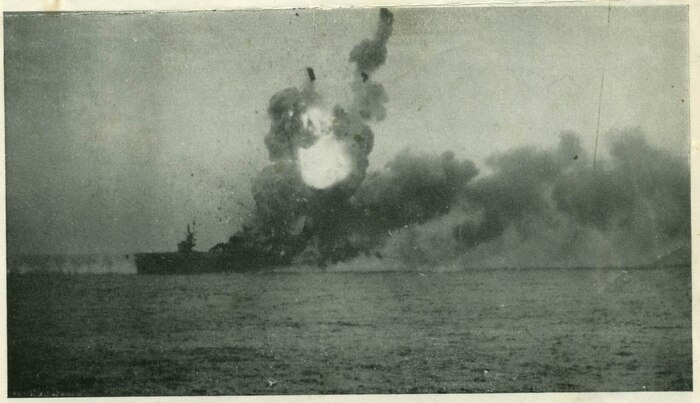 USS St. Lo (CVE 63) is badly damaged after a Japanese kamikaze plane hit the ship and caused an explosion. (U.S. Navy photo)