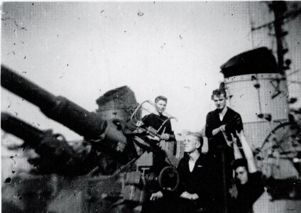 Navy Gunner's Mate Ernie Schramm fires a gun during World War II. (Photo courtesy Schramm and Gillard families)