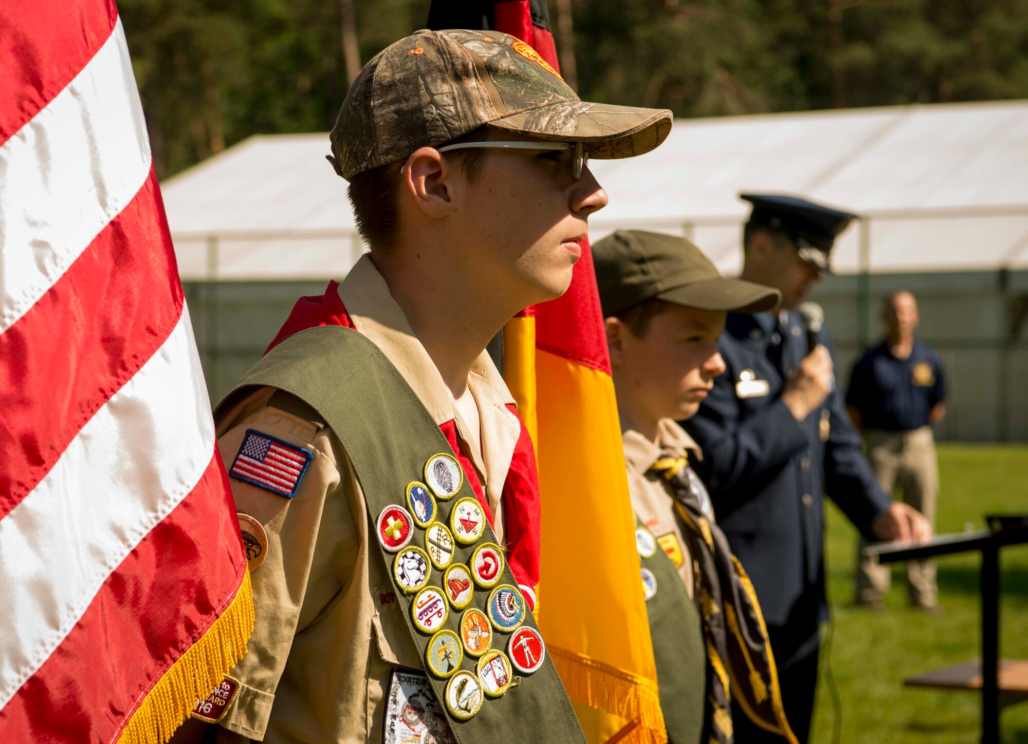 Children of Ramstein personnel who are members of the Boy Scouts of America act as color guard for the U.S. and German flags during a Flag Day flag disposal ceremony on Ramstein Air Base, Germany, June 14, 2017. The Boy Scouts of America supported the ceremony to help make sure that the flags were given proper respect during their disposal as defined by the United States Flag Code. (U.S. Air Force photo by Senior Airman Elizabeth Baker.)