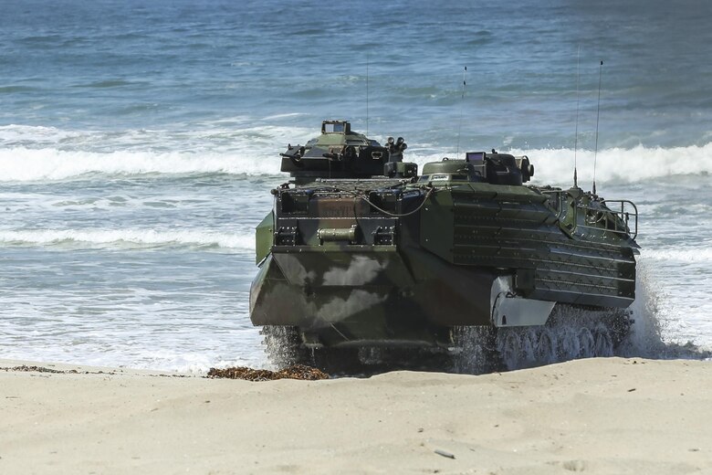 An Assault Amphibious Vehicle, with 15th Marine Expeditionary Unit, lands on Red Beach during the Marine Air- Ground Task Force demonstration for the 75th Anniversary on Camp Pendleton, Calif., June 14, 2017. The demonstration allowed civilians to observe Marines as they recertified their qualifications before deployment. (U. S. Marine Corps photo by Lance Cpl. Betzabeth Y. Galvan)