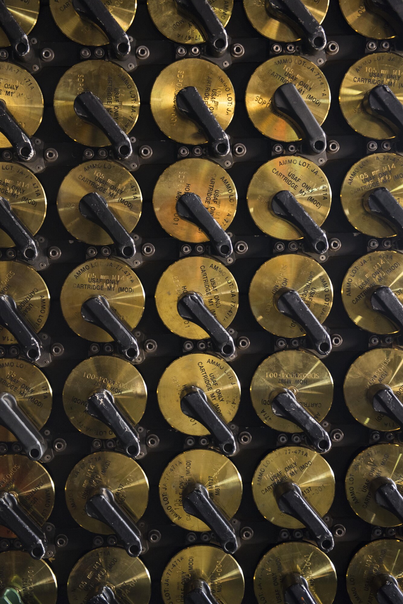105mm rounds sit in an ammunition rack aboard an AC-130W Stinger II gunship at Cannon Air Force Base, New Mexico, June 1`3, 2017. The two main guns on the gunship are the 30mm and the 105mm, with the 105 having to be loaded by hand after every shot. (U.S. Air Force photo by Staff Sgt. Michael Washburn/Released)